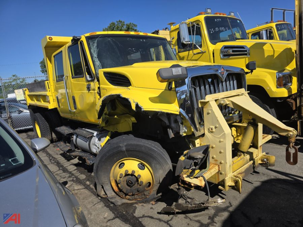 International WorkStar 7300 dump truck front view showing damaged front end and attachment for dump body.