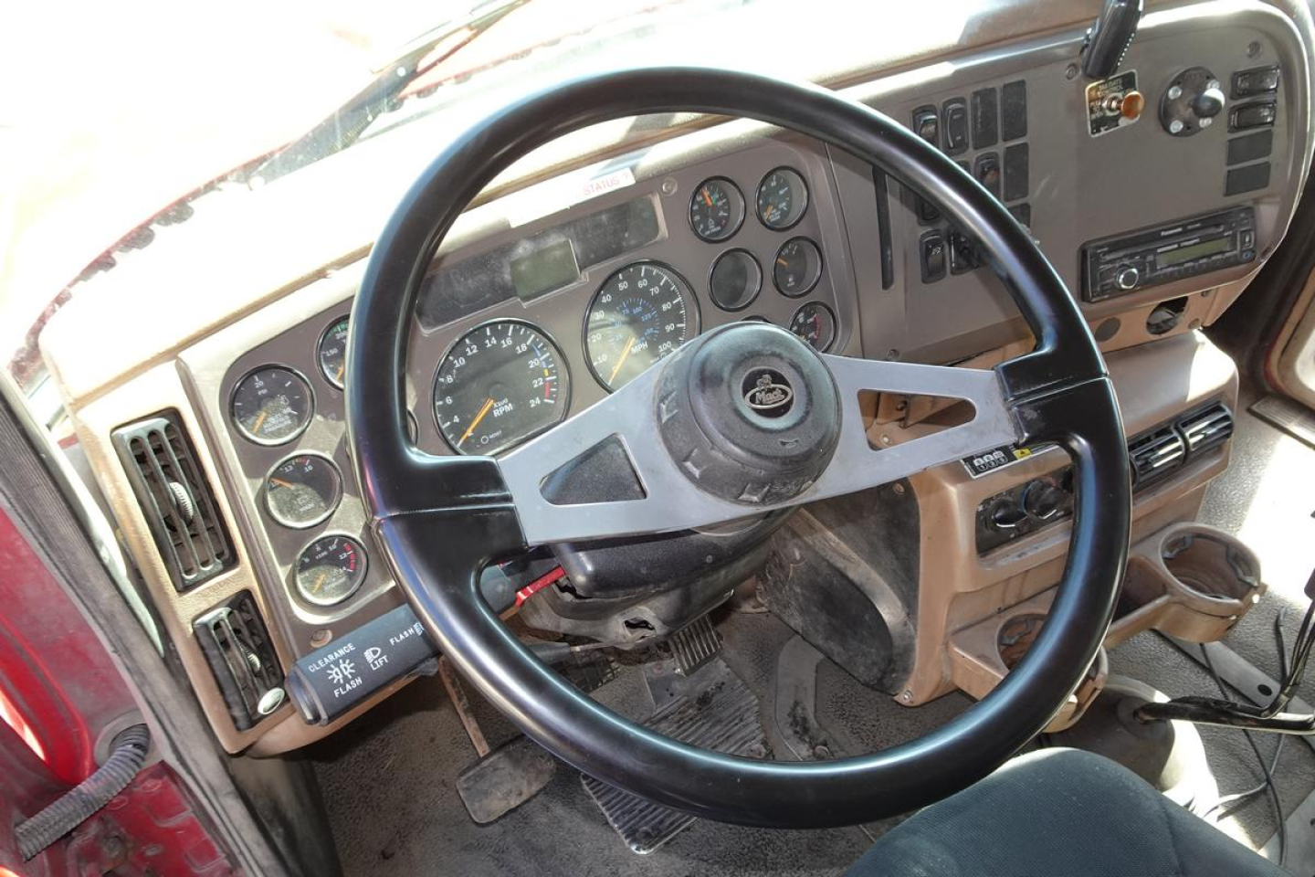 Mack CV Granite CV713 truck interior showing steering wheel and instrument cluster