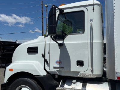MD6 truck cab side view showing Mack badge and door text
