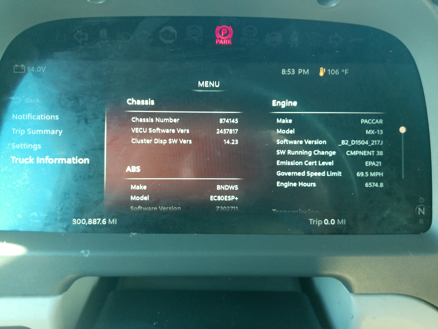 Peterbilt 579 dash display showing chassis and engine details including chassis number 874145 and engine information on the dashboard screen.