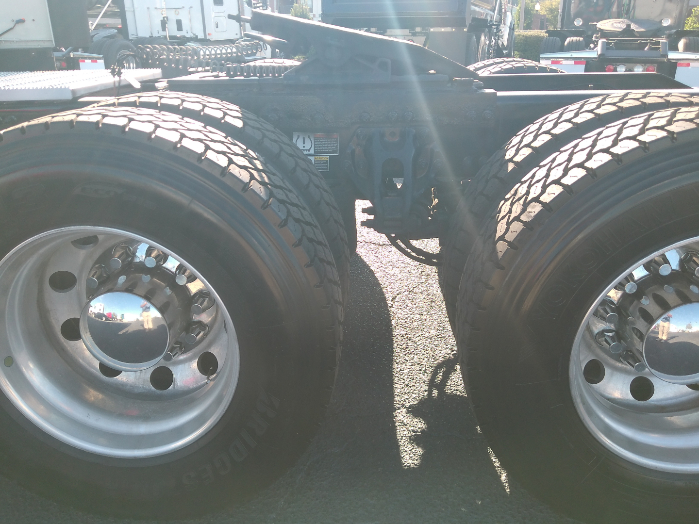Peterbilt 579 truck rear dual tires and chassis view showing wheel hubs and suspension mounting.