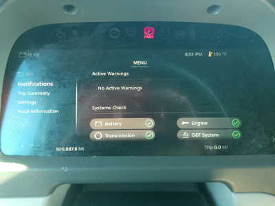 Peterbilt 579 instrument cluster display showing system checks with Battery and Transmission indicators and menu options.