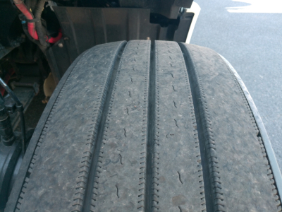 Truck tire tread close-up on Peterbilt 579 with wear marks visible