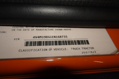 VIN tag showing VIN 4V4M19DG1EN168755 and barcode with classification Truck Tractor. Manufacturing date 203/18?23.
