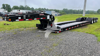 Fontaine lowboy trailer shown side view with black frame, long flatbed, triple-axle rear, and red/white reflective markings. Visible text includes 'FONTaine' on the side near the front, and additional stickers/labels unreadable at distance.