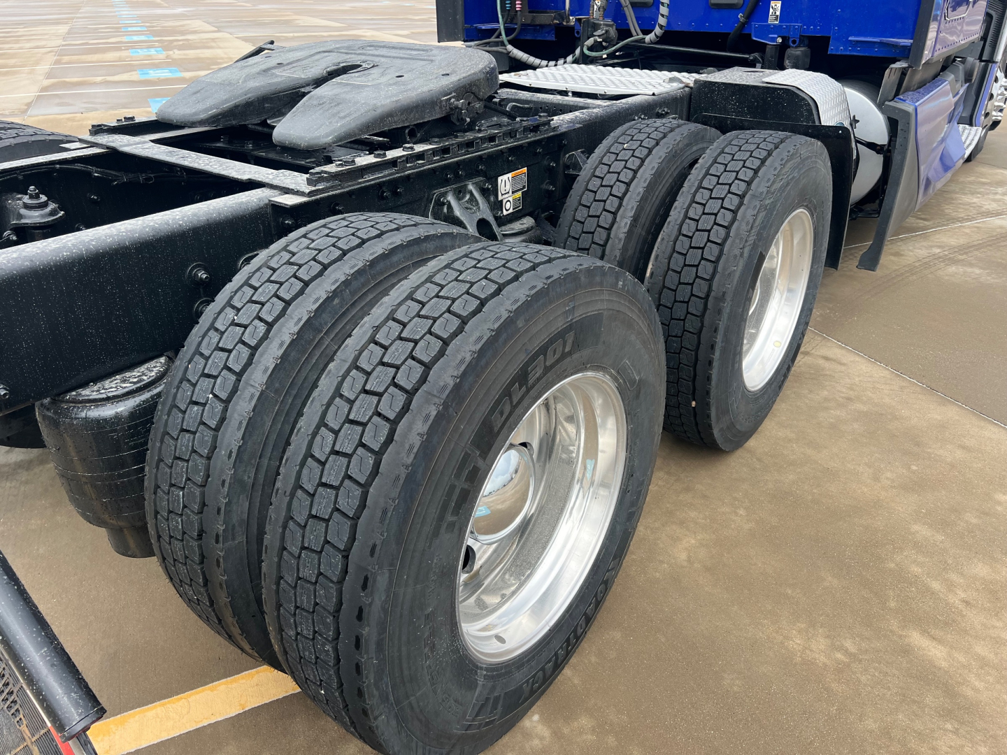Kenworth T680 chassis and dual rear axle wheels view showing tires and wheel rims.