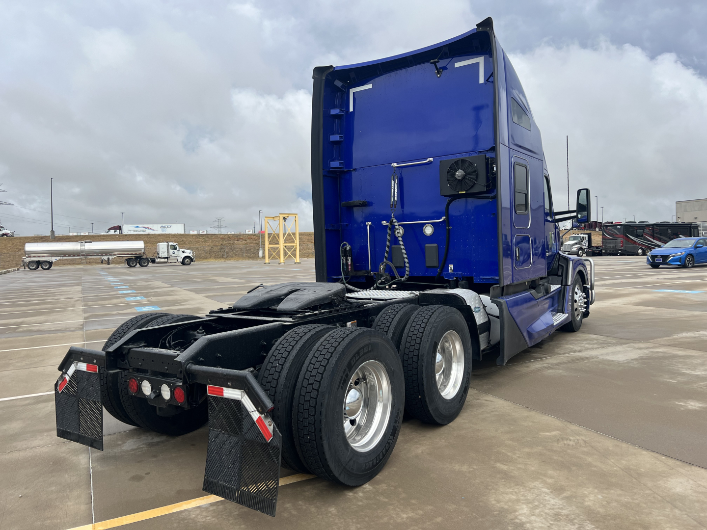 Kenworth T680 tractor rear and sleeper cab showing dual rear axles and fifth wheel.