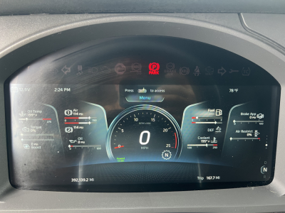 Kenworth T680 digital instrument cluster display showing speedometer at 0 mph, engine gauges, fuel, DEF, coolant, and tachometer readouts; multiple warning icons visible.