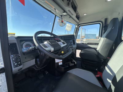 Cab and Chassis truck interior showing steering wheel, dashboard, and driver seat; no visible labels or stickers readable.
