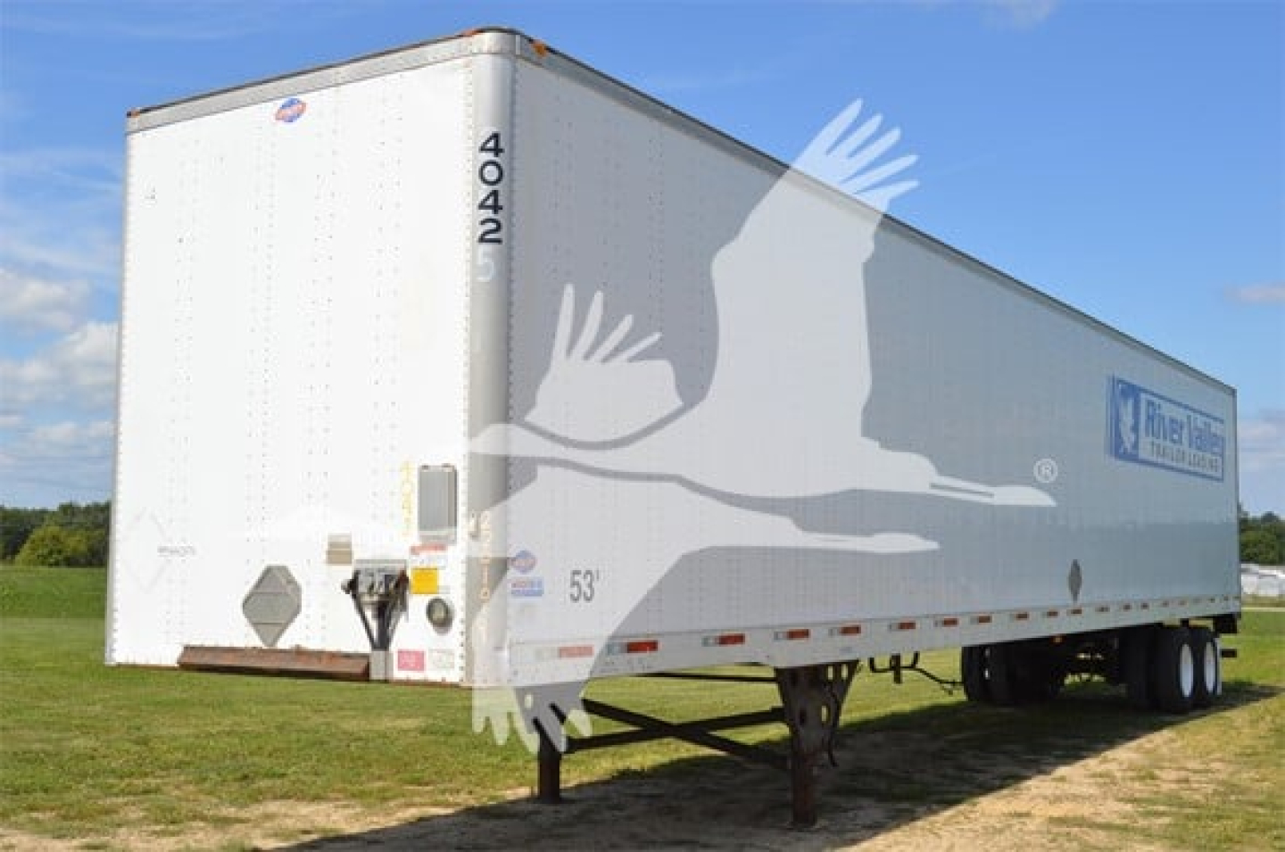 Trailer side view showing 4042 on the front corner and RiverBend brand logo on a white Utility 4000D-X trailer.