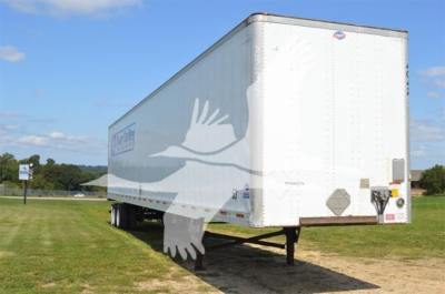 Used 2014 Utility 4000D-X trailer showing side and front, white exterior, dual rear wheels, hitch area visible.