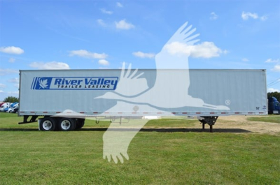 Trailer side view showing River Valley Transport Leasing logo on a 2014 Utility 4000D-X trailer with a blue sky background.