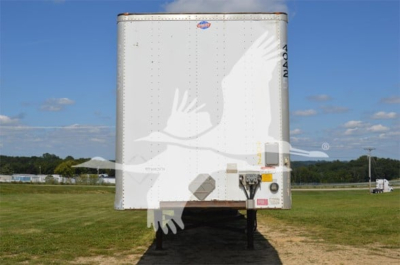 Trailer front view of a 2014 Utility 4000D-X utility trailer showing front and hitch area, with clear sky and grassy field.