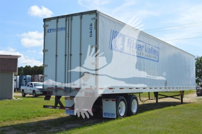 Utility trailer showing River Valley Transport & Leasing logo, tandem axle, side view, rear doors, stock number 4042 on door, 2014 model
