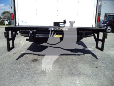 Isuzu NPR HD rear view showing Maxon bumper and undercarriage with plate and storage, cargo box tailgate visible.
