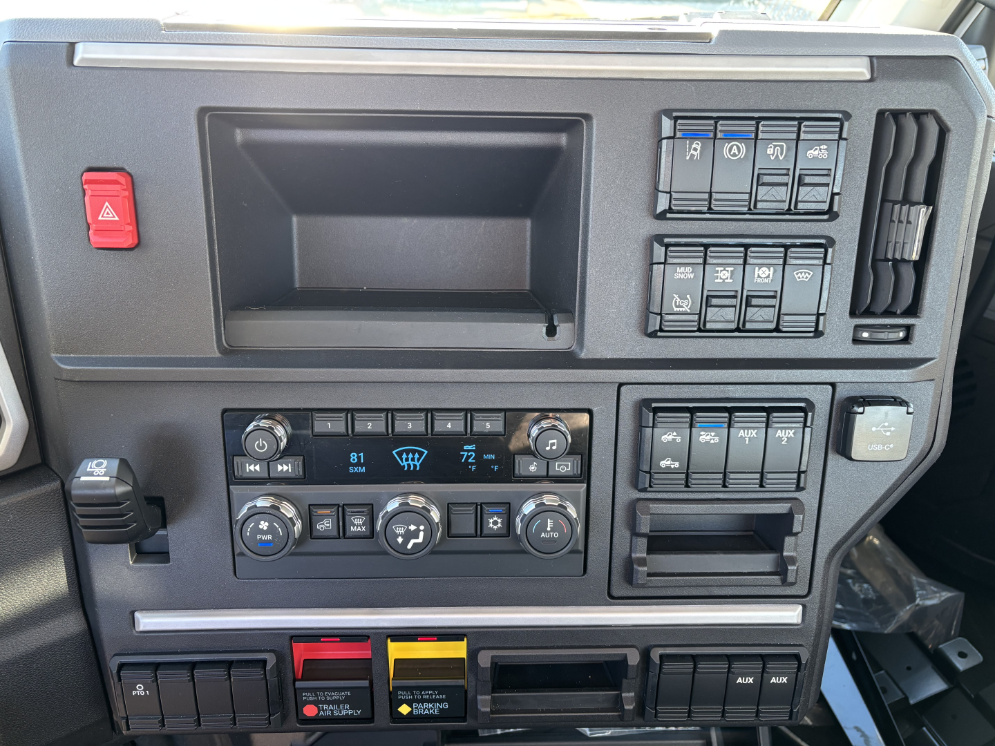 Dashboard of a 2027 Mack PR64T truck showing instrument cluster area with climate controls and switch panels.