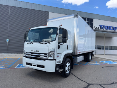 Isuzu FTR box truck in dealership lot, front-left view showing white cab and large cargo box, VIN 54DK6S1F5SSA00927 on listing, stock 66242.
