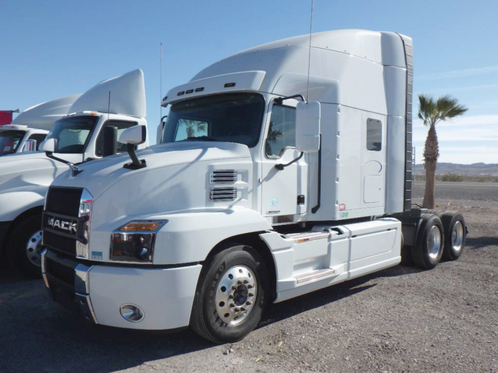 Tractor-trailer truck cab in white showing Mack emblem, SYM: 2022 Mack Anthem conventional sleeper with twin rear axles. VIN 1M1AN4GY4NM027355 and stock 554496 not visible on the image text.