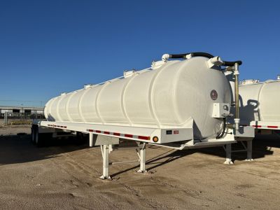 Dragon 130BBL vacuum trailer showing cylindrical tank on dual-axle frame with front support legs and rear piping attachments.