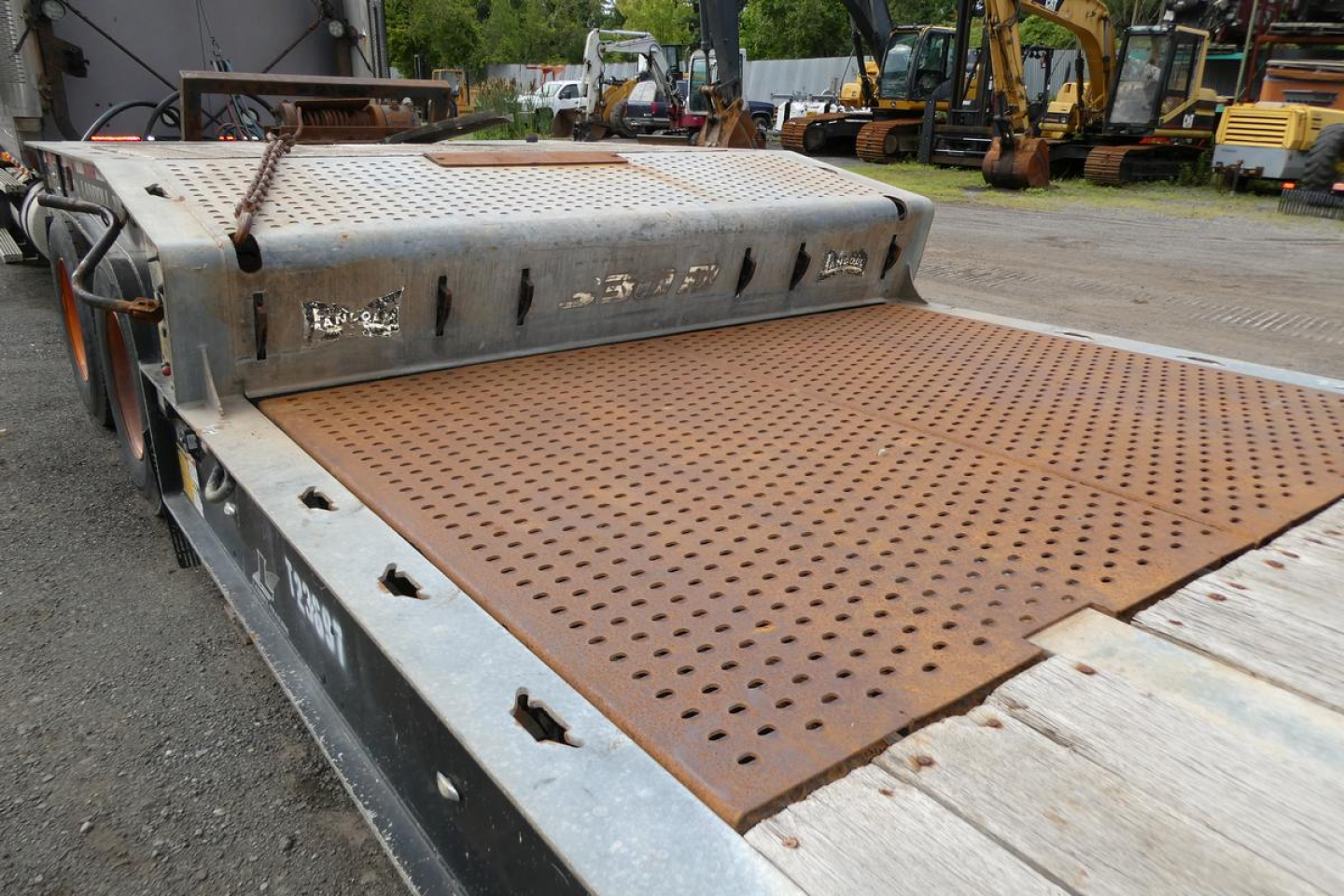 NGL trailer deck with perforated steel platform and storage box on the side, 2017 Landoll 930D NGL trailer.