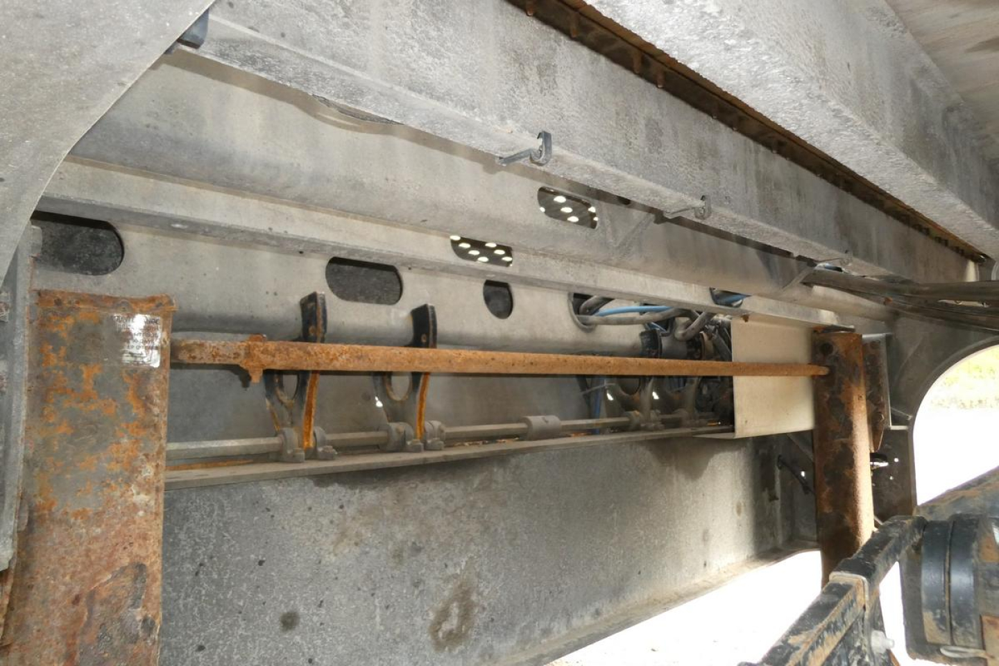 Trailer interior showing structural beams and linkage on Landoll 930D NGL. Visible text labels: VIN, stock number, and category in listing context.