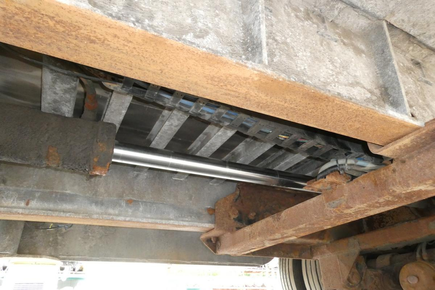 Landoll 930D NGL trailer undercarriage showing steel frame rails and hydraulic components.