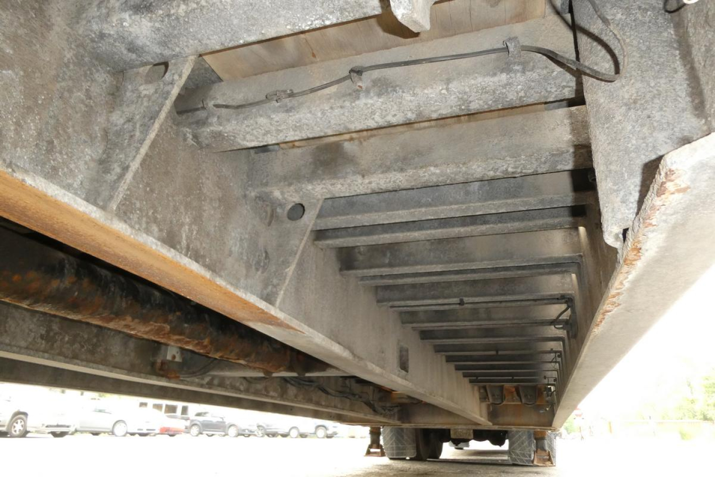 Underbody view of Landoll 930D NGL trailer showing structural cross members and underside framing.