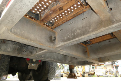 Trailer undercarriage view showing steel frame, cross members, and underside hardware of a 2017 Landoll 930D NGL trailer.