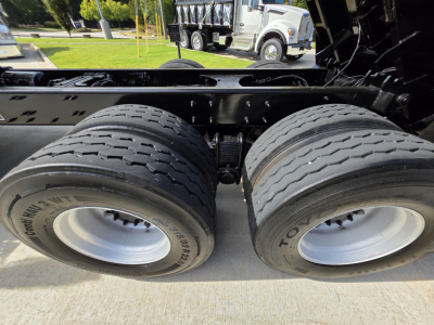 Dual rear truck tires on Mack GRANITE chassis showing tread and wheel rims.