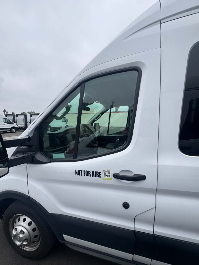 Ford Transit 350 HD XLT van side showing Not For Hire sticker on front door