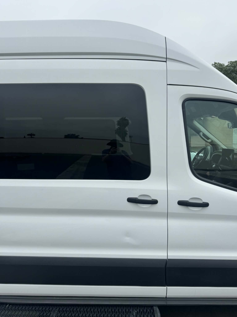 Ford Transit 350 HD XLT passenger van side profile showing side windows, door handles, and body line