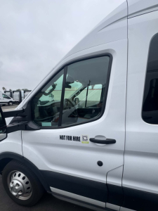 Ford Transit 350 HD XLT van side showing Not For Hire sticker on front door