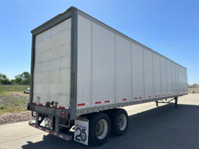  Trailer body showing box trailer with three axles and rear lights.