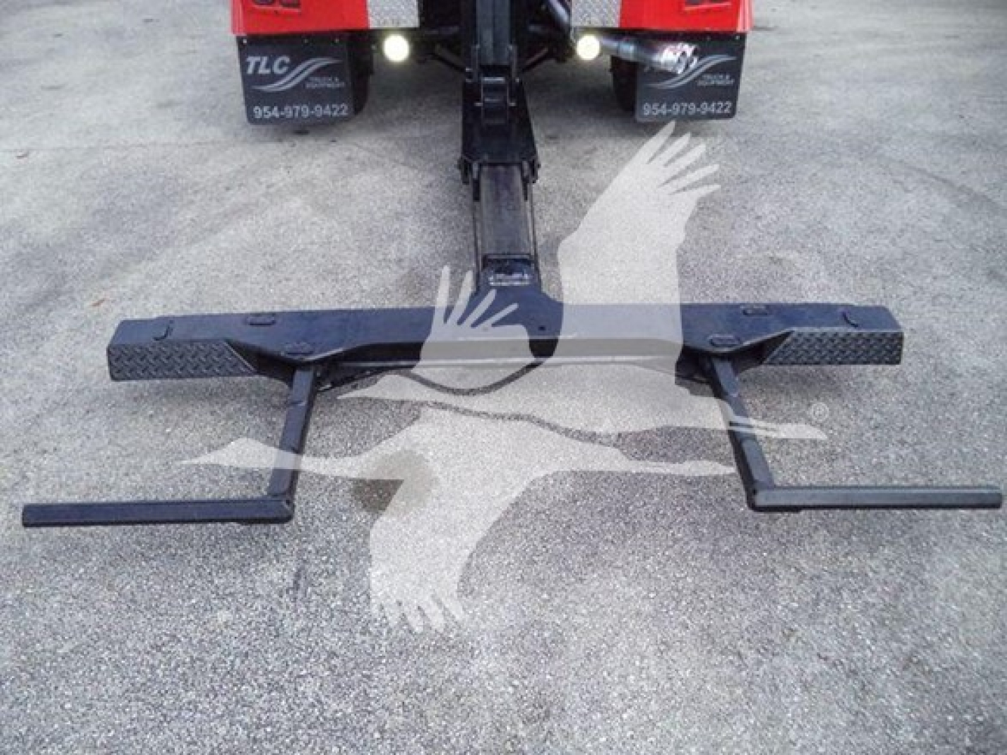 Winch-equipped 2017 Ford F-450 hitch/receivers with dual side blades and lifting bar, mounted on vehicle, view of recovery equipment and hitch assembly.
