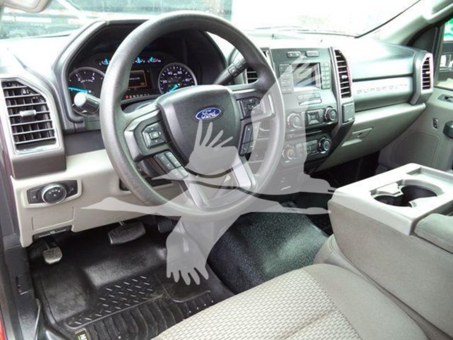 Ford F-450 interior dashboard and steering wheel view showing driver-side controls and center console.