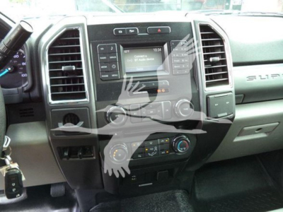 Ford F-450 dashboard and center console showing touchscreen infotainment system, climate controls, and gear selector area.