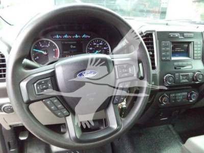 Ford F-450 interior with steering wheel and dashboard view.
