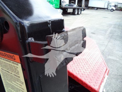 Winch-equipped 2017 Ford F450 hitch area showing damaged front bumper and warning label panel.