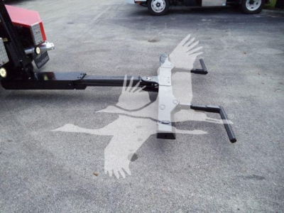 Winch mount assembly attached to a Ford F-450 truck showing a horizontal bar and mounting frame.