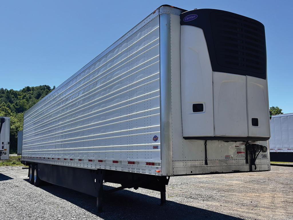 Utility 3000R refrigerated trailer in side/front view showing a tall white refrigeration unit at the front and corrugated aluminum sides.