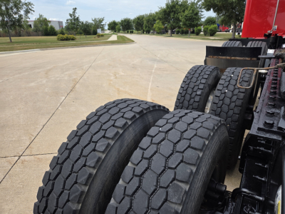 Peterbilt 567 truck rear dual tires and chassis view showing heavy duty tires and frame.