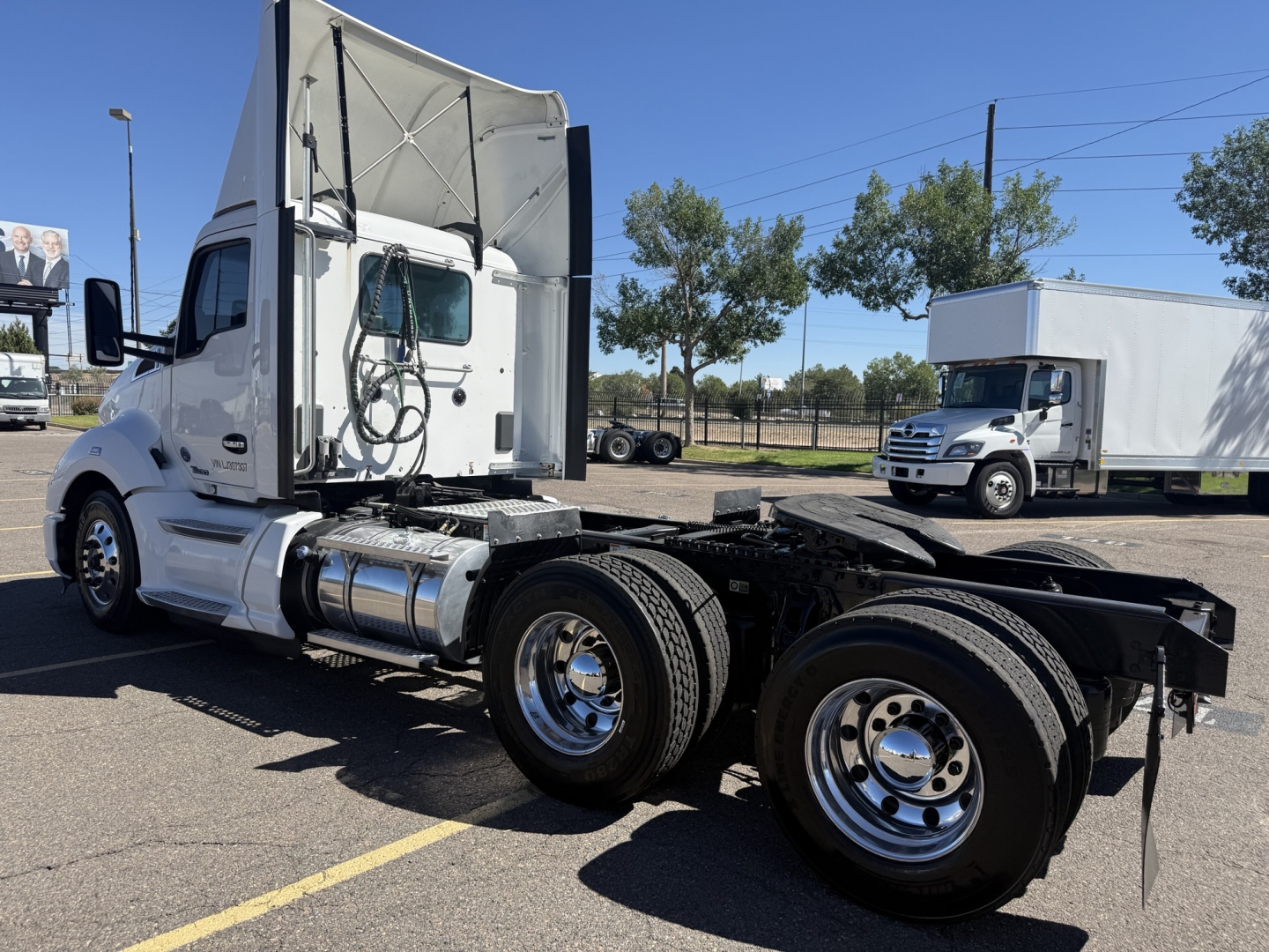 Kenworth T680 tractor side view showing cab, fuel tanks, and rear axle on chassis with no trailer attached.