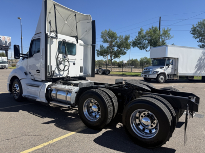 Kenworth T680 tractor side view showing cab, fuel tanks, and rear axle on chassis with no trailer attached.