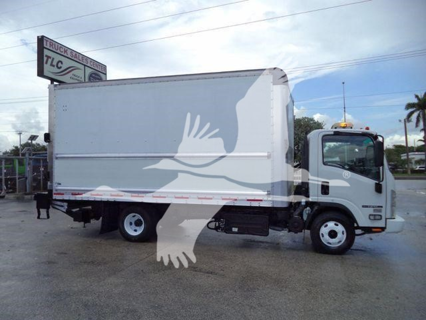 Isuzu NPR HD box truck side view showing cargo box and cab, stock number T05048FM, category box, used vehicle.