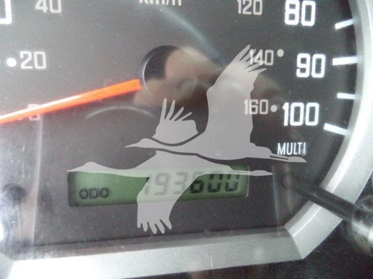 Isuzu NPR HD dashboard showing speedometer with odometer reading 93600 miles and digital display; overlay of watermark image.