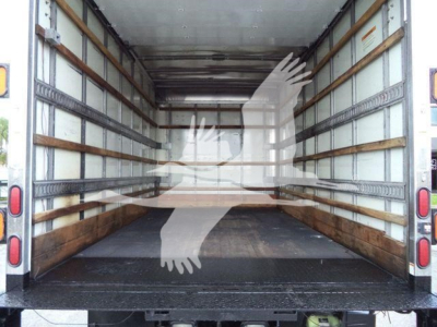 Isuzu NPR-HD box truck cargo area showing empty interior with metal track rails on walls and wooden floor; rear doors open; no cargo present.