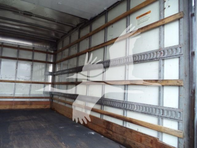 Isuzu NPR-HD box truck cargo area with metal side rails and wooden floor, stock number T05048FM visible in listing.