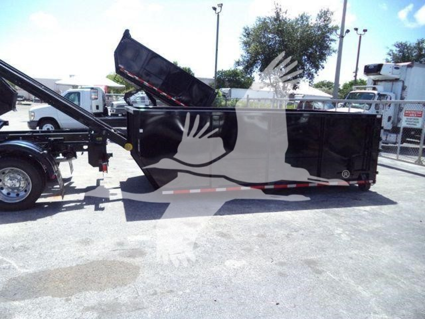 Truck bed shown with a raised dump box, Ram 5500 chassis cab style; no visible text on components.