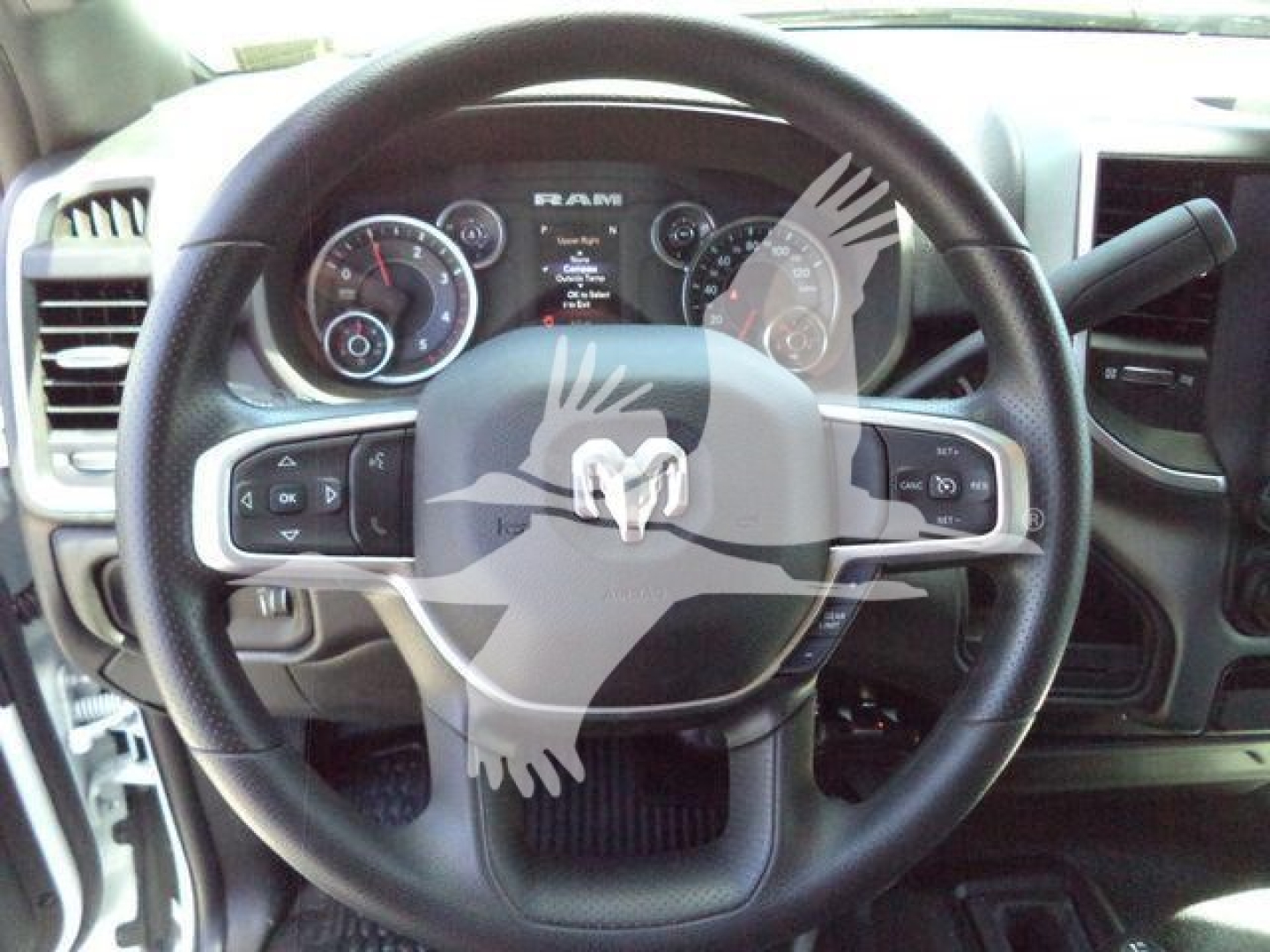 Ram 5500 HD SLT interior steering wheel and dashboard with RAM emblem and instrument cluster visible