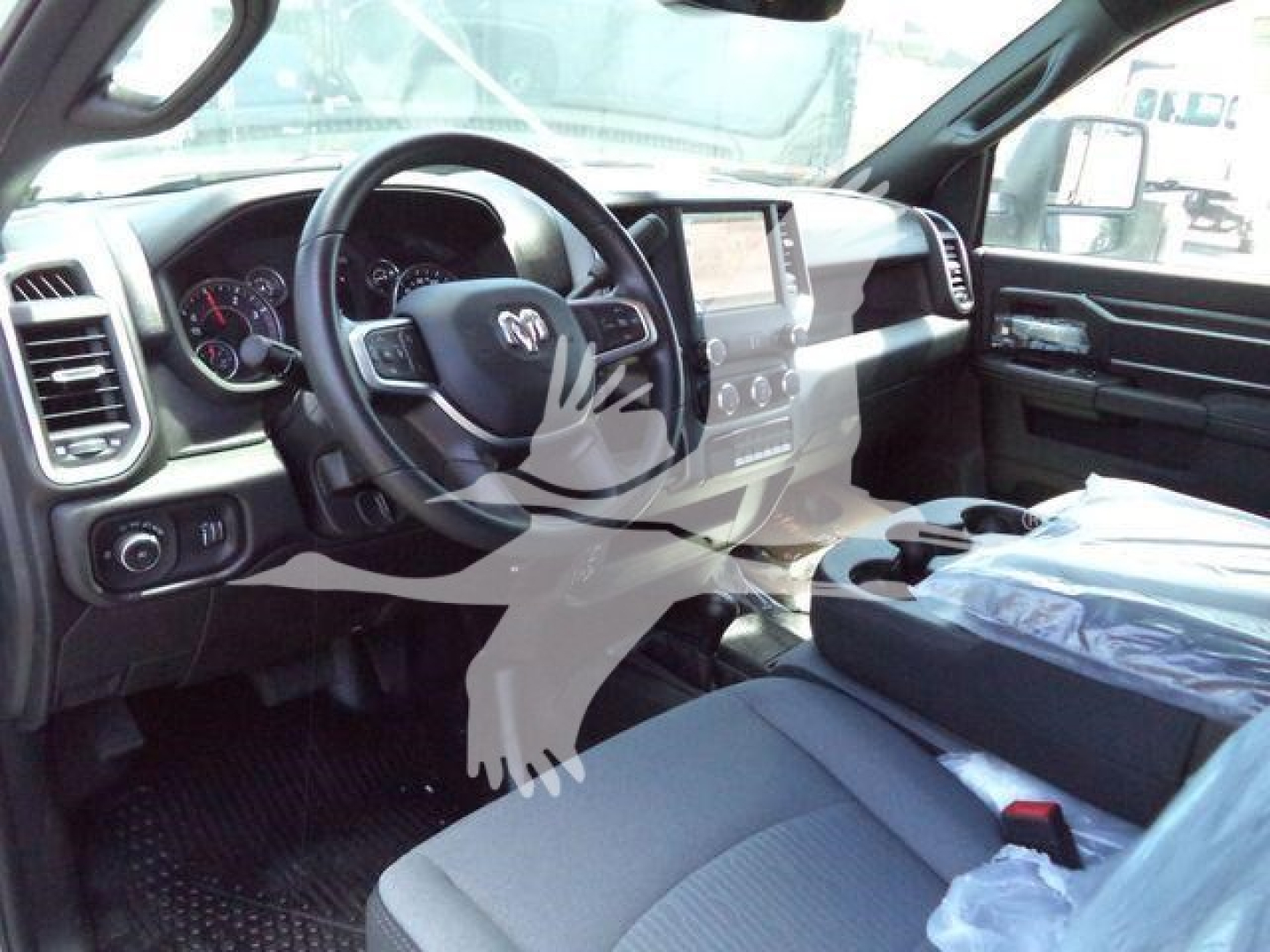 Ram 5500 interior dashboard and steering wheel view showing center console and front seats.
